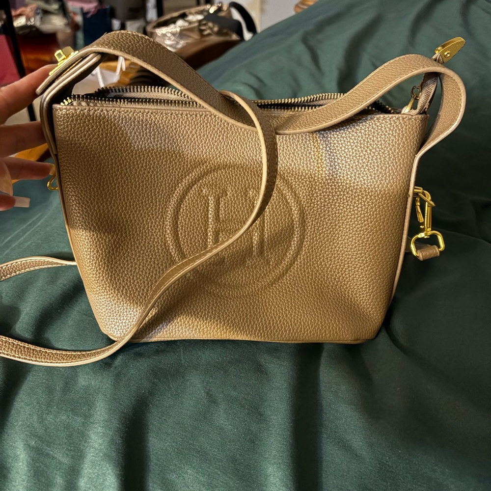 Tan Leather Crossbody Bag with Adjustable Strap and Embossed Logo
